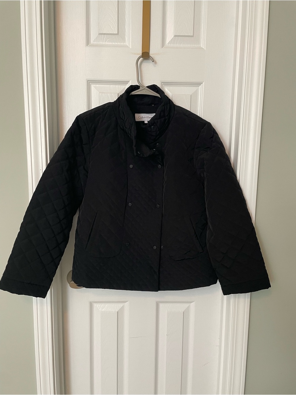 Calvin Klein double breasted quilted jacket with a mock neck